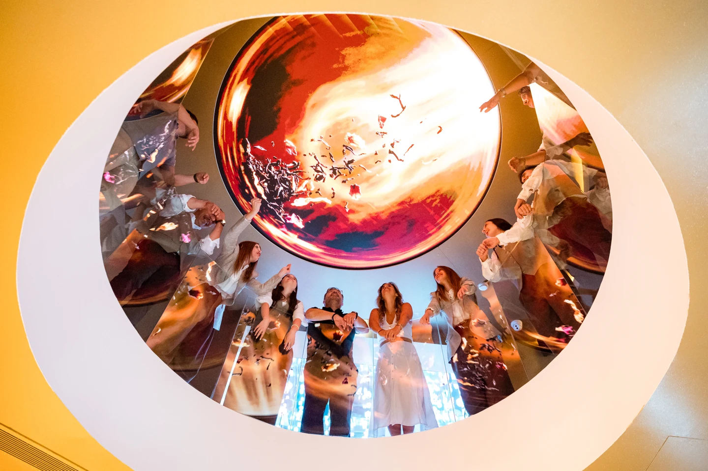 Visitors gathered beneath the colourful illuminated ceiling at The 100s Porto